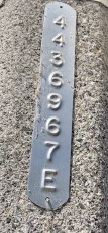 Numbered metal tag